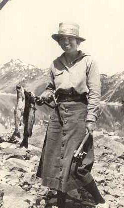 Eleanor `Nora` Saltonstall  in mountains holding fish Photograph